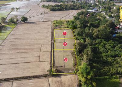 Aerial view of land plots marked for sale