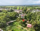 Aerial view of a property with surrounding greenery