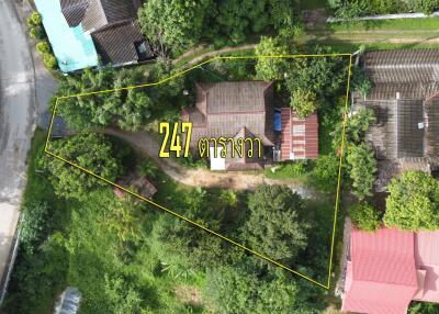 Aerial view of a property with highlighted boundary lines.