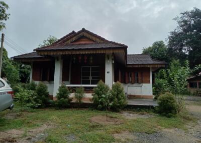 Exterior view of a residential house with a front yard