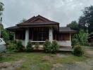 Exterior view of a residential house with a front yard