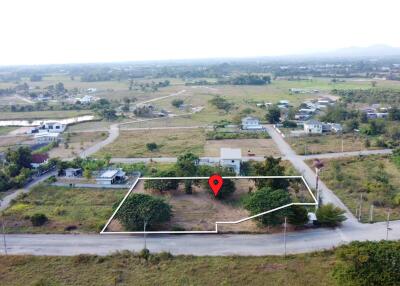 Aerial view of a land plot with surrounding area