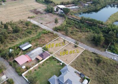 Aerial view of empty land plots for sale with area measurements