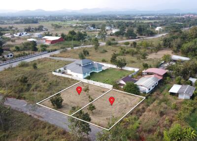 Aerial view of a neighborhood with plots of land marked