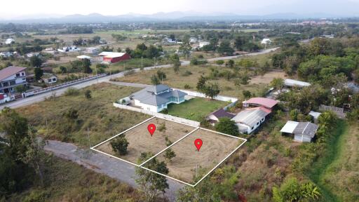 Aerial view of a neighborhood with plots of land marked