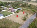 Aerial view of two adjacent land plots marked for sale