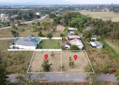 Aerial view of land and surrounding properties