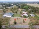 Aerial view of land and surrounding properties