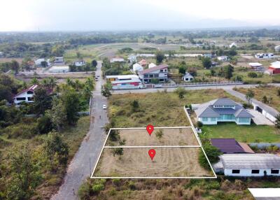 Aerial view of residential and undeveloped land