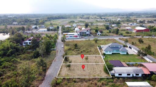 Aerial view of residential and undeveloped land