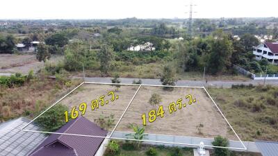 Two adjacent plots of land labeled with dimensions available for sale in a residential area