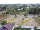 Two adjacent plots of land labeled with dimensions available for sale in a residential area