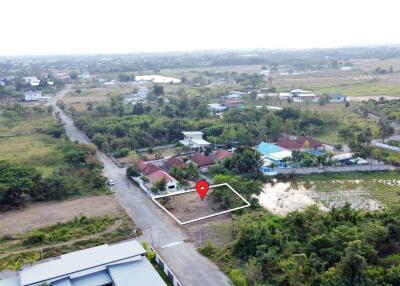 aerial view of a land plot in a suburban area