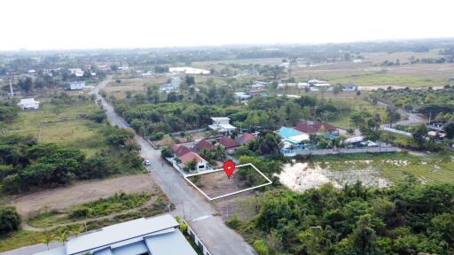 aerial view of a land plot in a suburban area