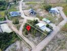 Aerial view of land with a property marker