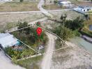 Aerial view of a land plot with surrounding area