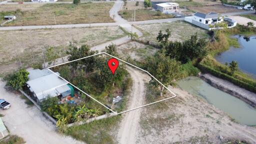 Aerial view of a land plot with surrounding area