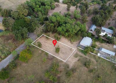 Aerial view of a plot of land marked with a red location pin