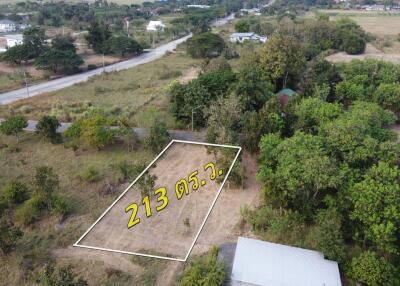 Aerial view of a land plot marked with area measurement