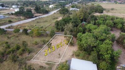 Aerial view of a land plot marked with area measurement