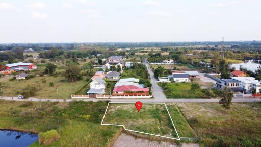 Aerial view of a land plot in a residential neighborhood