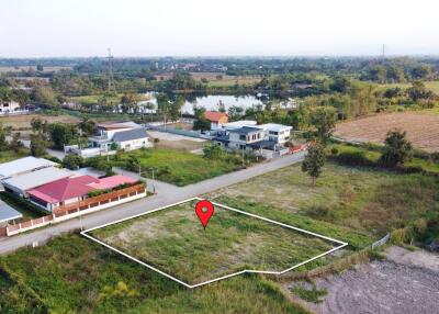 Aerial view of a residential land plot in a suburban area