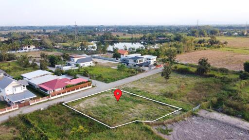 Aerial view of a residential land plot in a suburban area