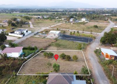 Aerial view of land plot with surrounding area