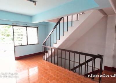 Spacious living area with staircase