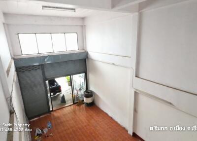 interior view of a commercial space with roller shutter door