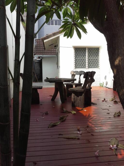 Outdoor patio with wooden furniture