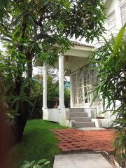 Outdoor view of a residential building with garden