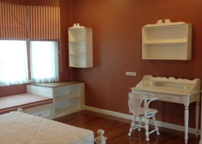 Bedroom with wooden floor and furniture