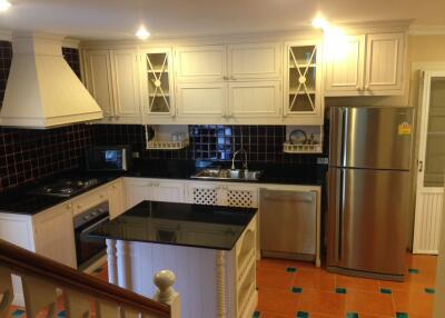 spacious kitchen with modern appliances and island