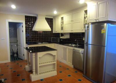 Modern kitchen with island and stainless steel appliances