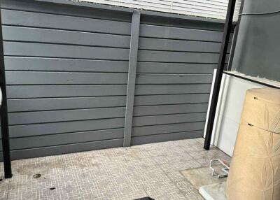 Balcony with grey panel wall