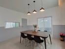 Modern dining area with hanging lights