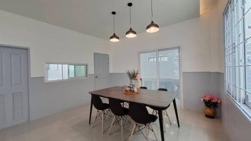 Modern dining area with hanging lights