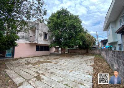 Outdoor area with a paved yard and surrounding buildings