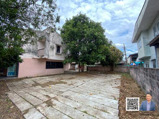 Outdoor area with a paved yard and surrounding buildings