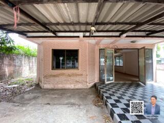 Exterior view of a building with a checkered floor entrance