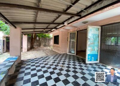 Covered outdoor area with checkered floor tiles