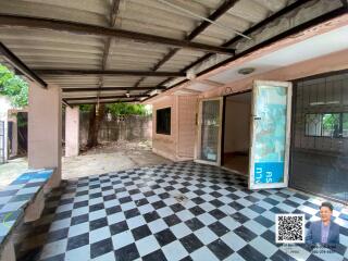 Covered outdoor area with checkered floor tiles