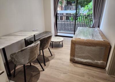 Modern living room with dining area and balcony