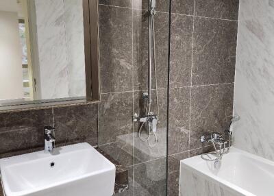 Modern bathroom with sink, shower, and bathtub