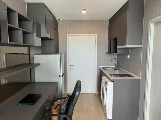 Modern kitchen with grey cabinetry and built-in appliances