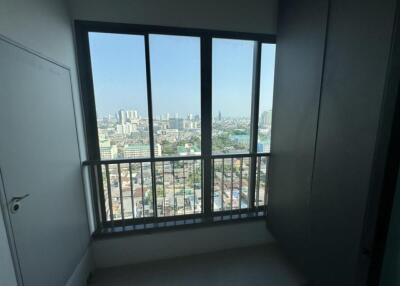 View from a room with large window overlooking cityscape