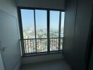 View from a room with large window overlooking cityscape