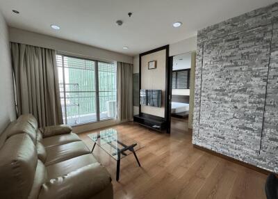 Modern living room with large windows and balcony view