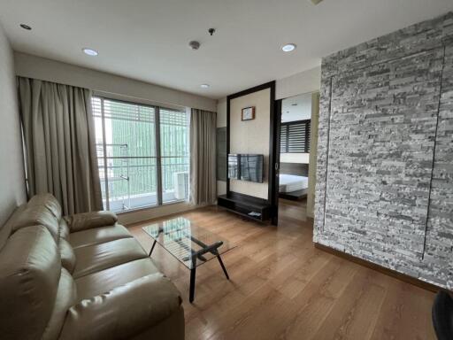 Modern living room with large windows and balcony view